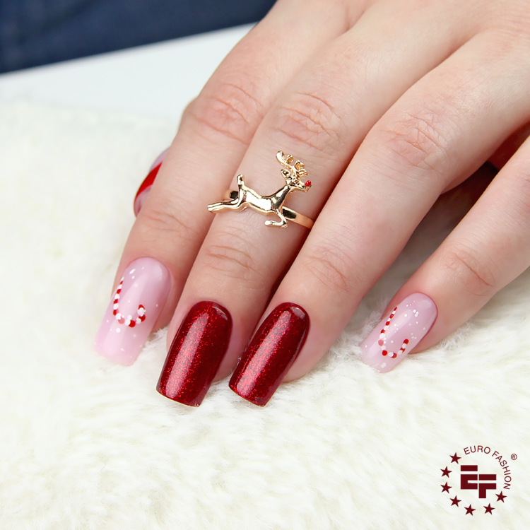 Czerwony brokat Inspire Electric w świątecznej stylizacji paznokci.