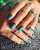 Lakier hybrydowy GELme ONE Coat Iron Green 352 w stylizacji paznokci