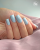 Lakier hybrydowy GELme ONE Coat Blue Mistic w stylizacji paznokci.