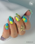 Lakier hybrydowy GELme ONE Coat Sky Punch w zdobieniu paznokci.